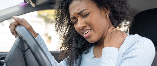 Woman suffering from neck pain after car accident Denver